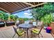 Outdoor deck features a dining table and chairs with a retractable awning at 840 2Nd St, Clermont, FL 34711