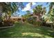 Beautifully landscaped home with mature trees and manicured lawn at 840 2Nd St, Clermont, FL 34711