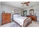 Spacious bedroom featuring a ceiling fan, and ample natural light, complete with matching dressers at 840 2Nd St, Clermont, FL 34711