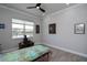 Calming bedroom space with a large window, serene view, and decorative accents at 8682 Bridgeport Bay Cir, Mount Dora, FL 32757