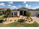 Beautiful single-story home with manicured landscaping and a welcoming front entrance at 8682 Bridgeport Bay Cir, Mount Dora, FL 32757