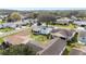 An aerial view of a well-kept neighborhood, highlighting the home's backyard and surrounding greenery at 901 Chula Ct, The Villages, FL 32159