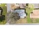 Aerial view of the gray roof and the surrounding landscaping of this well-maintained single Gathering home at 901 Chula Ct, The Villages, FL 32159