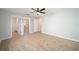 Spacious bedroom with modern wood-look flooring and ensuite bathroom at 901 Chula Ct, The Villages, FL 32159