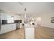 Modern kitchen with stainless steel appliances and granite countertops, flowing into the dining area at 901 Chula Ct, The Villages, FL 32159