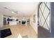 Open concept living space featuring modern lighting and seamless flow into the kitchen and dining area at 901 Chula Ct, The Villages, FL 32159