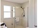 Bathroom featuring updated, glass enclosed shower with modern fixtures at 901 Chula Ct, The Villages, FL 32159