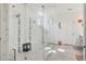 Luxurious main bathroom with a large glass shower, dual shower heads, and modern fixtures at 977 Timberview Rd, Clermont, FL 34715