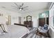 Serene main bedroom with hardwood floors, neutral decor, and a large window at 977 Timberview Rd, Clermont, FL 34715