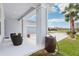 Inviting front porch with seating and views of the landscaped front yard and neighborhood at 977 Timberview Rd, Clermont, FL 34715