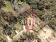 Aerial view of a property showcasing a newly constructed home, wooded surroundings, and overall lot layout at Lot 15 Indian Estates Cr 423, Lake Panasoffkee, FL 33538