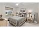 Cozy bedroom featuring a ceiling fan and a window for natural light at 2277 Whisper St, The Villages, FL 32162