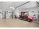 Well-lit garage featuring a golf cart and additional storage space at 2277 Whisper St, The Villages, FL 32162