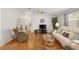 Spacious living room with ceiling fan, neutral walls, and lots of natural light at 2277 Whisper St, The Villages, FL 32162