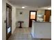 Open kitchen area with classic cabinetry and wainscoting at 100 W Idlewild Ave, Eustis, FL 32726