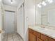 Well-lit bathroom with a sink vanity, mirror, and shower/tub combination at 10230 Barrington Ct, Leesburg, FL 34788