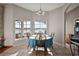 Dining Area with beautiful view from large window. Tile flooring throughout adds easy maintenance at 10606 Masters Dr, Clermont, FL 34711