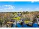 Stunning aerial view of the neighborhood with homes, docks, and waterfront access at 11101 Versailles Blvd, Clermont, FL 34711