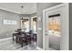 Cozy dining room with natural light and view of screened pool at 11101 Versailles Blvd, Clermont, FL 34711