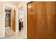 Hallway view leading to a tiled shower and bedroom, highlighting the home's functional layout at 1119 Cr 457, Lake Panasoffkee, FL 33538