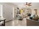 Inviting living room featuring tile flooring and a comfortable seating area with a decorative ceiling fan at 1119 Cr 457, Lake Panasoffkee, FL 33538