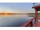 Stunning sunset view overlooking a tranquil lake, offering a serene and picturesque waterfront setting at 11243 Dead River Rd, Tavares, FL 32778