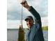 Happy fisherman with a freshly caught bass, enjoying the recreational activities available near the lakes of Tavares at 11243 Dead River Rd, Tavares, FL 32778