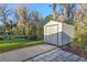 Exterior shot of the shed on the grounds of this lakeside property with mature trees at 11243 Dead River Rd, Tavares, FL 32778