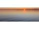 Beautiful sunset over the water at 11243 Dead River Rd, Tavares, FL 32778