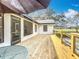 Back deck featuring a table and chairs at 12220 County Road 209, Oxford, FL 34484