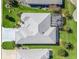 Aerial view of the house showing the roof, yard and landscaping at 12390 Se 176Th Loop, Summerfield, FL 34491