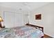 Bedroom featuring a ceiling fan, closet, hardwood floors, and natural light at 1273 Oak Forest Dr, The Villages, FL 32162