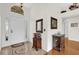 Inviting foyer featuring elegant tile flooring, a stylish front door and decorative wall accents at 1273 Oak Forest Dr, The Villages, FL 32162