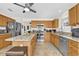 Spacious kitchen featuring an island, stainless steel appliances and ample cabinet space at 1273 Oak Forest Dr, The Villages, FL 32162