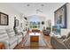 Bright living room featuring wood flooring, vaulted ceilings and an abundance of natural light at 1273 Oak Forest Dr, The Villages, FL 32162