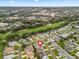 Aerial view of a residential community, showcasing the layout of the neighborhood and nearby golf course at 1303 Fontana Ct, Lady Lake, FL 32159