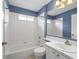 Cozy bathroom featuring a tub-shower combination and a single sink vanity, maximizing functionality at 1303 Fontana Ct, Lady Lake, FL 32159