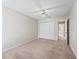 Neutral bedroom showing carpeted floor and a closet providing a serene and comfortable space at 1303 Fontana Ct, Lady Lake, FL 32159