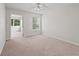 Bedroom featuring access to a screened-in porch and large window, enhancing natural light at 1303 Fontana Ct, Lady Lake, FL 32159