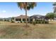 View of the screened in lanai from the backyard at 1312 Patrick Pl, The Villages, FL 32162