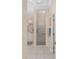 Bright bathroom features walk-in shower, white vanity, and neutral tile flooring at 1312 Patrick Pl, The Villages, FL 32162