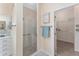 Lovely bathroom with walk-in glass shower and door leading to walk-in closet at 1312 Patrick Pl, The Villages, FL 32162