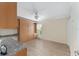 Bright bedroom featuring wood floors, ceiling fan, and built in cabinet with shelves and drawers at 1312 Patrick Pl, The Villages, FL 32162