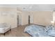Spacious main bedroom with sitting area, ceiling fan and light laminate flooring at 1312 Patrick Pl, The Villages, FL 32162