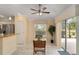 Cozy dining area with a view of the backyard through sliding glass doors, complemented by natural light at 1312 Patrick Pl, The Villages, FL 32162