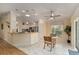 Bright and airy kitchen featuring granite countertops, stainless steel appliances, and a cozy breakfast nook area at 1312 Patrick Pl, The Villages, FL 32162