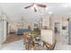 Spacious living room with an open floor plan, hardwood floors, and ample natural light at 1312 Patrick Pl, The Villages, FL 32162