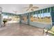 Bright sunroom features tiled floors and views of the backyard at 1312 Patrick Pl, The Villages, FL 32162