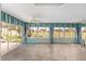 Bright sunroom features tiled floors and views of the backyard at 1312 Patrick Pl, The Villages, FL 32162