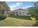 Expansive backyard with a screened lanai and beautifully maintained lawn at 1339 Florence Path, The Villages, FL 32162